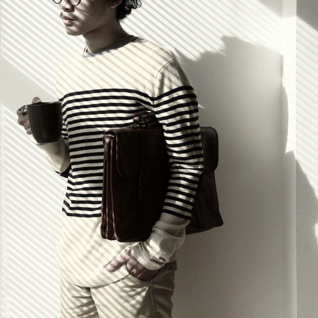 This image of a man with a file under his arm is being used for illustrative purposes in a blog post on ADHD task paralysis